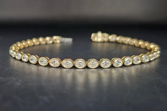 7" 4.9 carat lab-grown oval diamond tennis bracelet in yellow gold