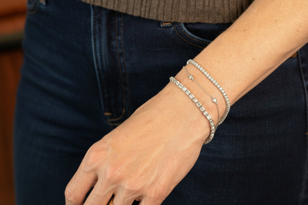 station bracelet, 4 carat tennis bracelet and 6.25 carat emerald cut tennis bracelet - all in white gold