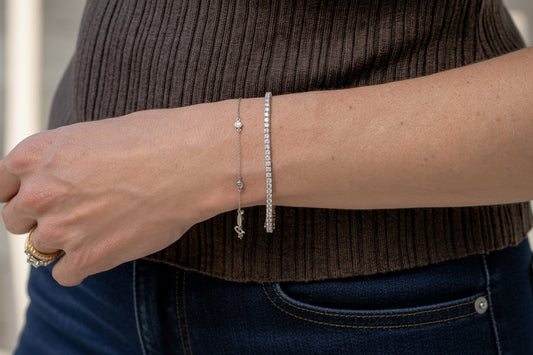 station bracelet and 4 carat total weight tennis bracelet - both in white gold