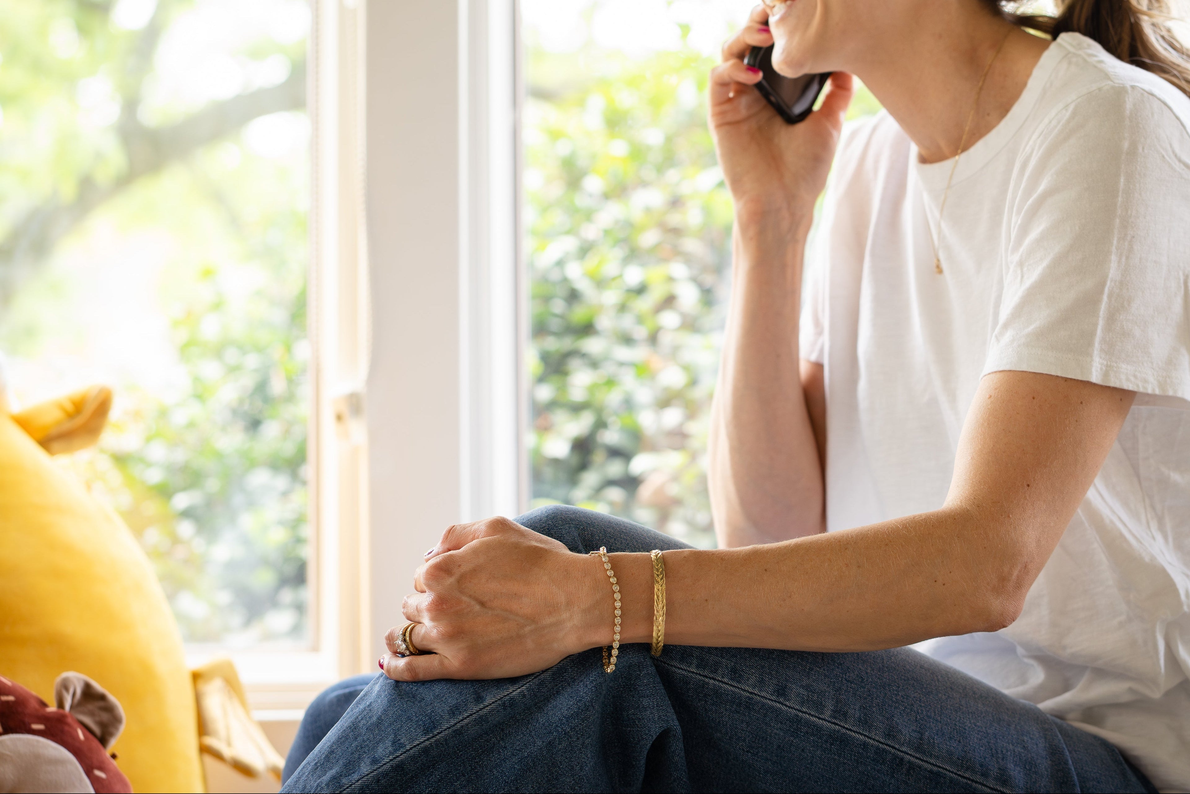 7" 4.9 carat lab-grown oval diamond tennis bracelet in yellow gold with sold gold bracelet