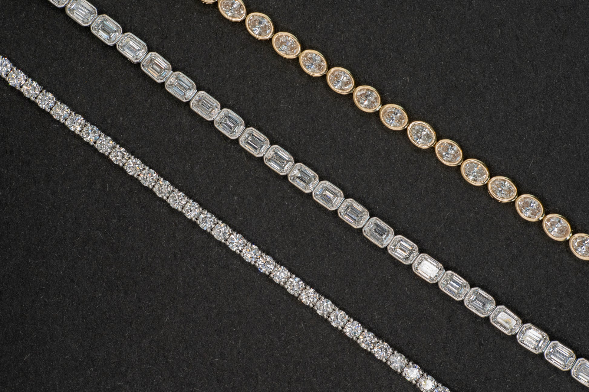 white gold 4 carat tennis bracelet, 6.25 carat white gold emerald cut tennis bracelet, and 4.9 carat yellow gold oval tennis bracelet